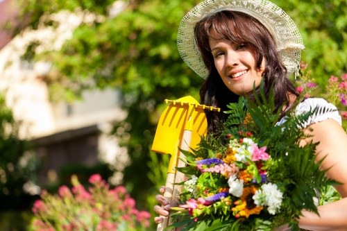 Gardener reviewing hedge work during an inspection